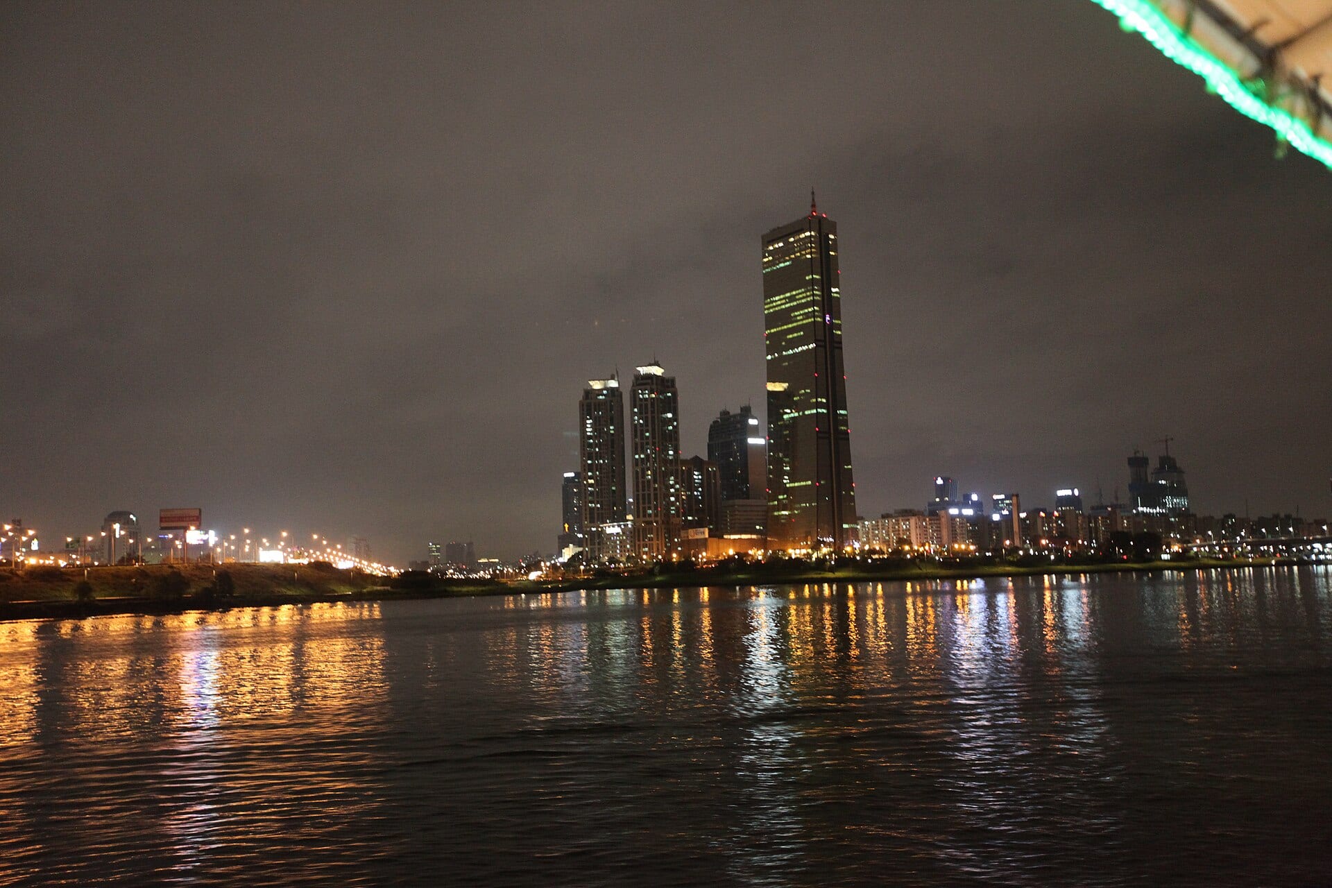 The Yeouido district of Seoul at night, seen across the Han river.